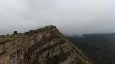 Canyon with a fast mountain river flowing along its bottom. Village of Goor Stock Footage 314876258