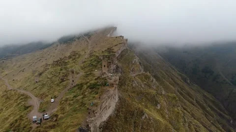 Canyon with a fast mountain river flowing along its bottom. Village of Goor Stock Footage 314876538