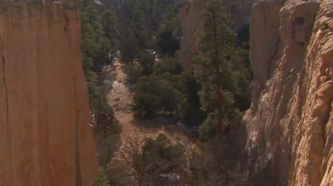 Canyon floor in between divided rock cliffs Stock Footage 60588251