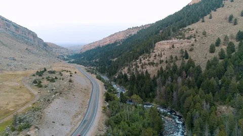 Canyon Highway with River Stock Footage 124683196