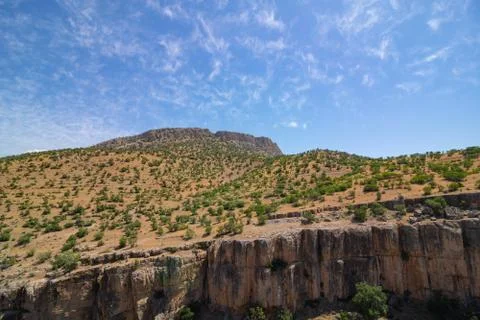 A canyon with a mountain in the background Stock Photos