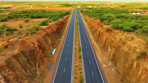 Canyon Like Mountains With a Highway Inbetween - Backwards Stock-Footage 249554092