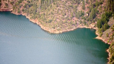 Canyon Rim high angle view in Flaming Gorge Utah green river wake ripples Stock Footage 120605098