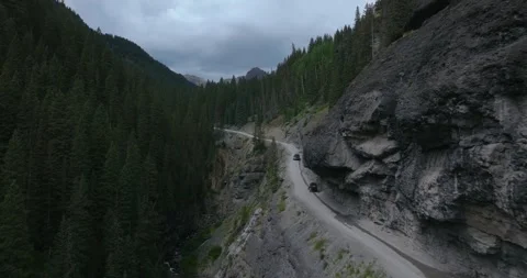Canyon Road Beneath Towering Cliffs Aerial Vídeo Stock 331113348