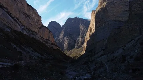 Canyon with a stream in high mountains and blue sky, parallax, drone shooting Stock-Footage 218315018