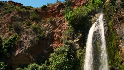 Canyon Waterfall Till down pan left Stock Footage 156528201