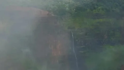 Canyon waterfall Timelapse with clouds and fog Stock Footage 166468538