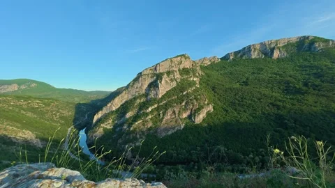 Canyon winds through rugged peaks under clear blue skies, timelapse. Serbia Stock Footage 337052824