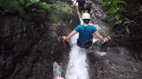 Canyoneering pov going down a mountain stream Stock Footage 63502913