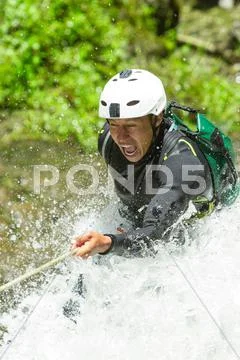 Canyoning Guide Trying Out A New Route In Chama Waterfall Banos De Agua Santa Stock Photos