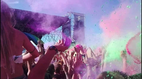 Caorle (VE) 13/08/2017 - Crowd of people in colourful powder on holi festival Stock Footage 129554548