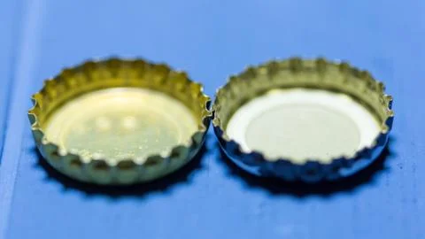 Cap on blue background Stock Photos