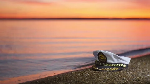 Cap captain on the river Bank. At sunset. Video stock 56939449