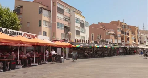 Cap D'Agde City center with several restaurants and cafes around the marina on Stock Footage 314269677