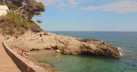 Cap d'Ail Coastal Path and Rocky Mediterranean Cove on the French Riviera Stock Footage 344210864
