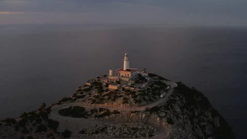 Cap de formentor - airial drone shot of the lighthouse at sunset Video stock 167615436