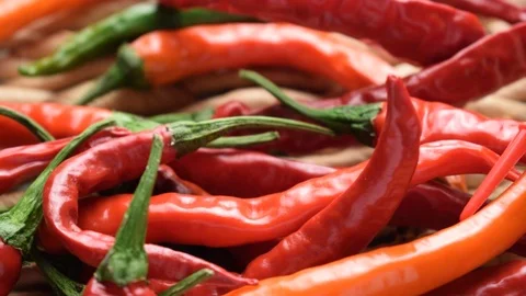 Cap of a red pen on hot pepper Stock Footage 122658566