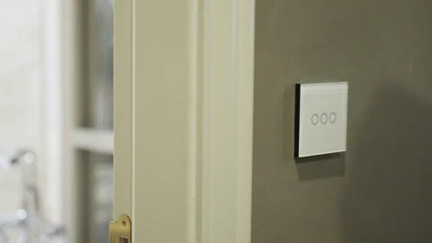 Capacitive touch switch to control room lighting on and off in luxury hotels. Video stock 245083001