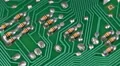 Capacitors Electronic Components Mounted Motherboard Green Printed Circuit Board HD Footage