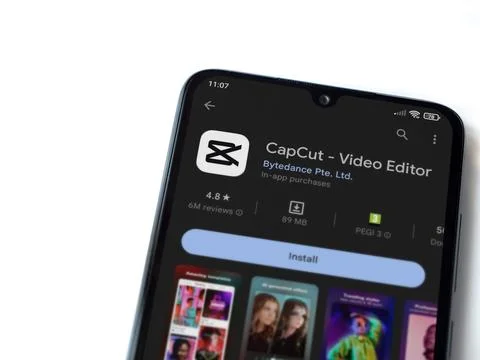 CapCut app play store page on smartphone on white background. Stock Photos