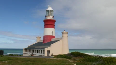 Cape Agulhas lighthouse, crane shot, sky, spring flowers, Ocen reveal Stock Footage 163437754