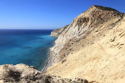 Cape Aspro: breathtaking rugged cliffs over Mediterranean waters in Cyprus. Fotos de archivo