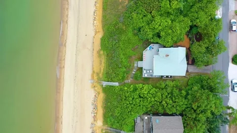Cape Cod Aerial Top-Down of Homes, Sandy Beach, and Greenery Stock Footage 317679054
