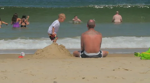 Cape Cod Beach Toddler sand castle Stock Footage 66072204