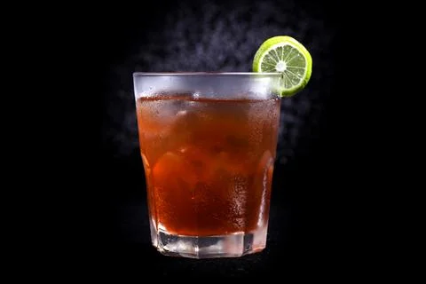 Cape Cod Cocktail on black background, selective focus, soft focus. Stock Photos