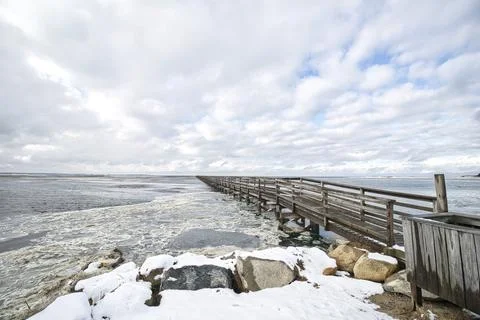 Cape Cod Grays Beach Boardwalk Snow on Rocks Stock Photos