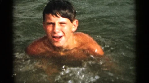 CAPE COD MASSACHUSETTS-1956: Boy Swimming Having Fun With His Mom At The Beach Video stock 125304620