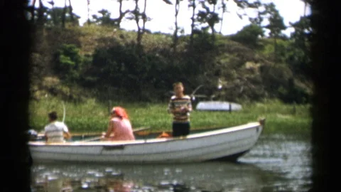 CAPE COD MASSACHUSETTS-1956: Two Boys And A Woman Fish On A White Boat In The Stock Footage 125304464