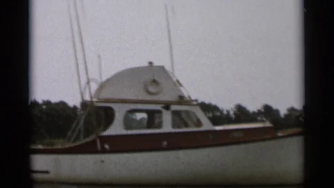 CAPE COD MASSACHUSETTS-1956: White Motorboat On Calm Water Vídeos de archivo 125304499