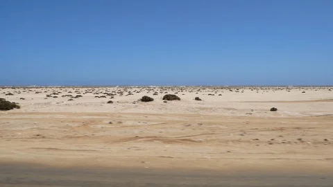 Cape Cross camera car, dry landscape, Namibia, Africa in HD, blue sky Stock Footage 91080938