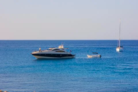 Cape Greco Cyprus at sunset coast and boat Stock Photos