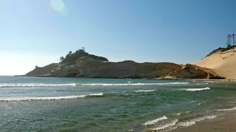 Cape Kiwanda sandstone cliffs and a massive sand dune meeting the ocean in Pa-71 Stock-Footage 345392478