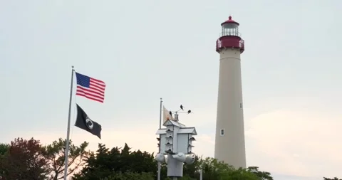 Cape May Lighthouse with flags during sunset time, South New Jersey - 4K Stock Footage 246984410