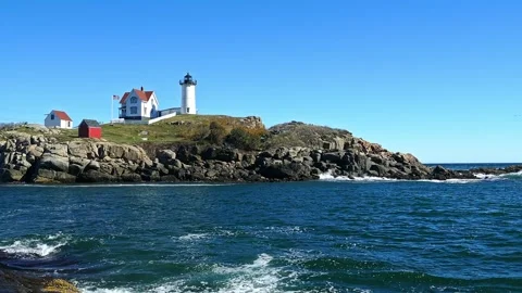 Cape Neddick "Nubble" Lighthouse in a beautiful day with blue sky Stock Footage 323283507