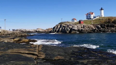 Cape Neddick "Nubble" Lighthouse with blue sky Stock Footage 109059850