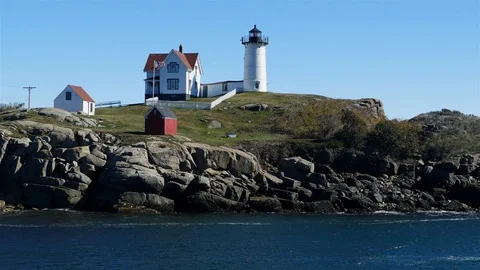 Cape Neddick "Nubble" Lighthouse with blue sky Stock Footage 109061278