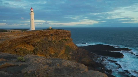 Cape Nelson lighthouse on top of the cliffs at sunset in Australia Stock Footage 91073148