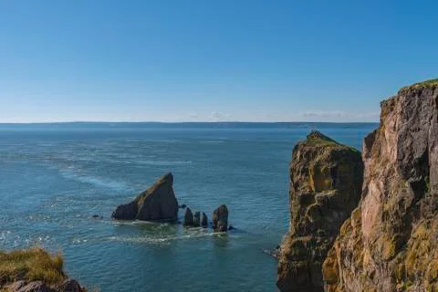 Cape split cliffs and tidal current Stock Photos