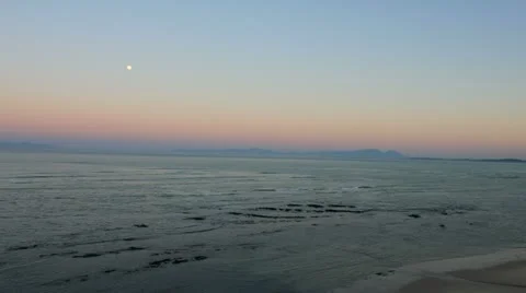 Cape, The Strand Moon over Falsebay Table Mountain in backround Stock Footage 10893775