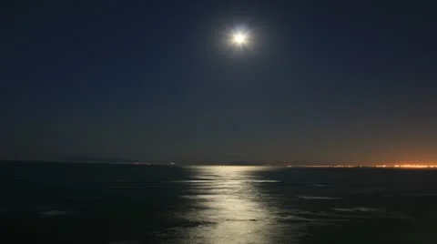 Cape, The Strand Moonset over Falsebay Table Mountain in back Stock Footage 10895007