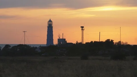 Cape tarhankut with lighthouse during sunset Stock Footage 119884536