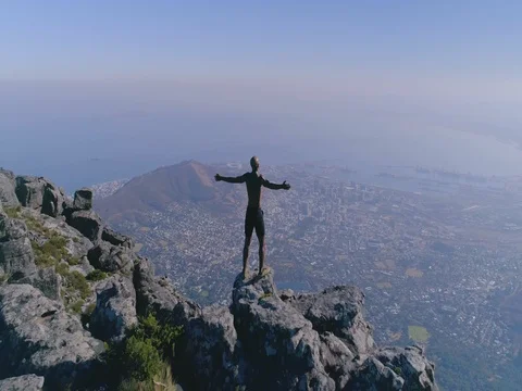 Cape Town Man Looking over City From Table Mountain Aerial Shot Stock Footage 79809646