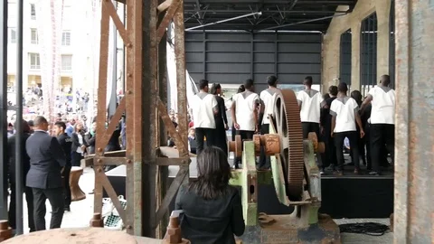 Cape Town  OPENING OF Zeitz MOCAA, crane lift shot from back of stage of dancing Stock Footage 80283973