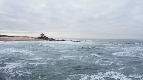 Capela do Senhor da Pedra beach on sandy pinissula washed by winter cold Atlanti Stock-Footage 319970112