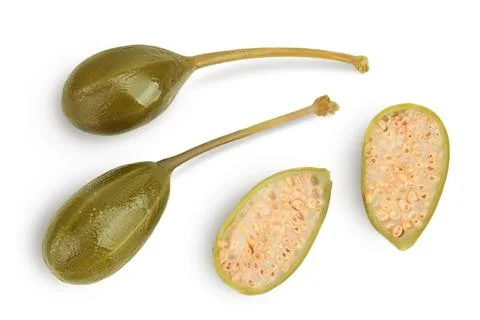 Capers isolated on white background. Pickled or canned capers. Top view. Flat Stock Photos