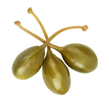Capers isolated on white background. Pickled or canned capers. Top view. Flat Stock Photos